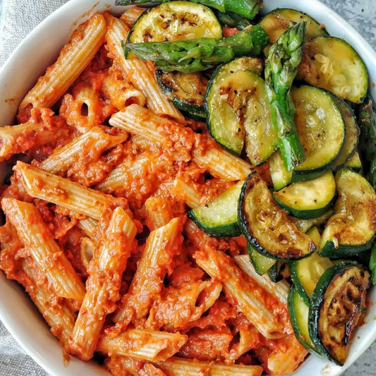 Puréed Carrot Bolognese Penne Pasta with Roasted Mediterranean Greens. (Contains Gluten)